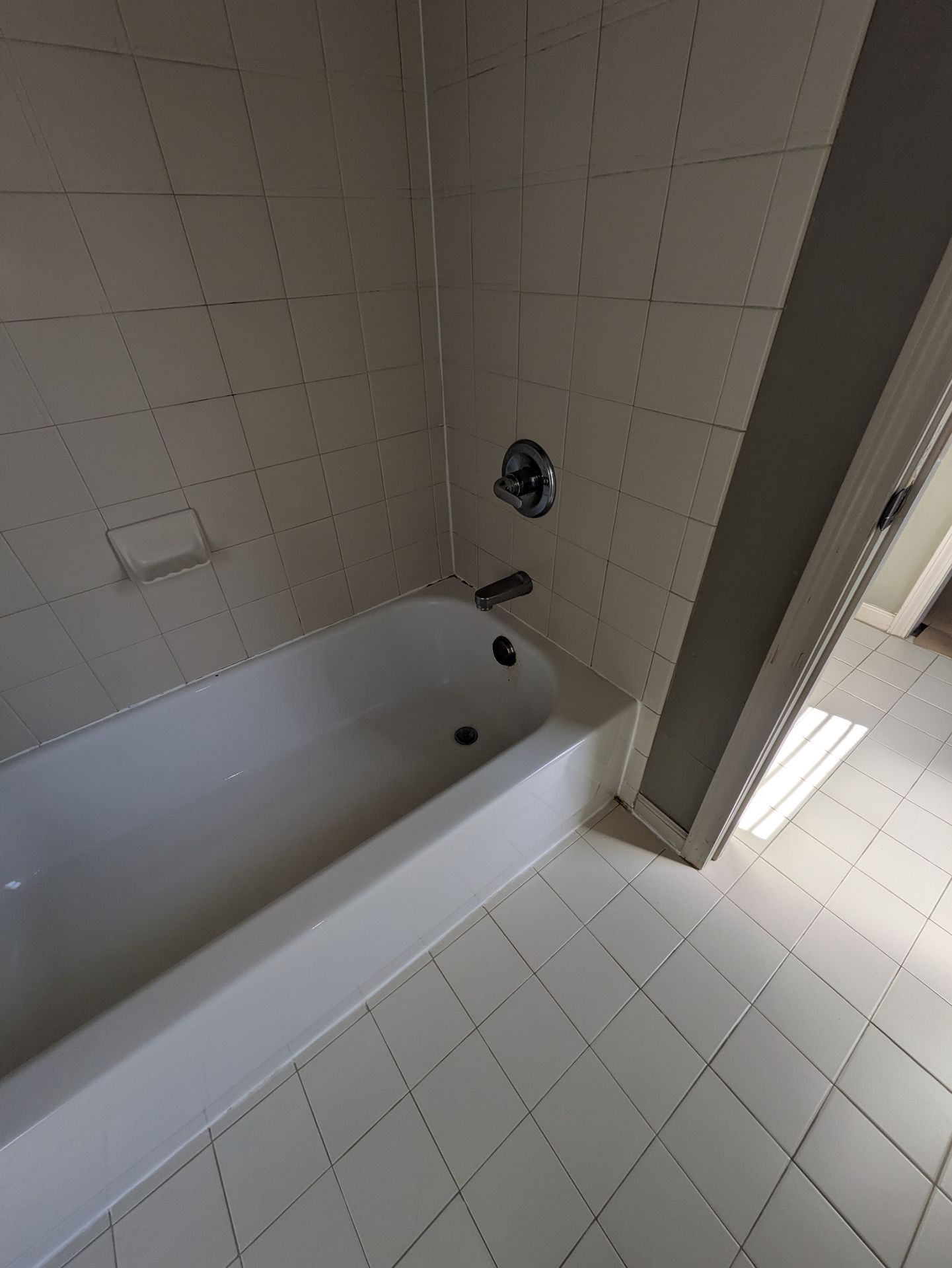 New white bathtub installed in a renovated Normaltown bathroom